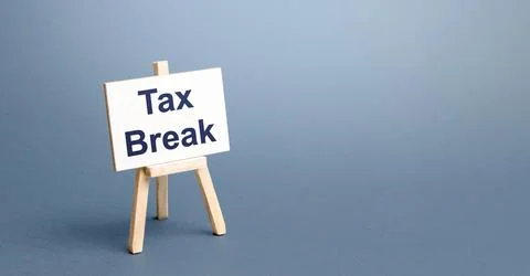 Tax break easel. Avoiding or deferring tax payments. Refund of taxes deduct.. Stock Photos