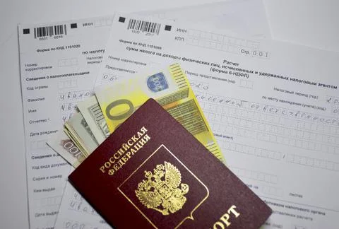 Tax declaration forms, above the passport of a citizen of Russia with money Stock Photos