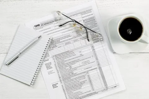 Tax documents on desktop Stock Photos