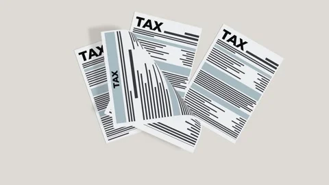 Tax forms accumulating on a gray background, isolated Video stock 310650383