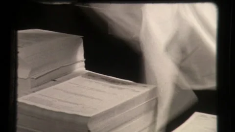 Tax Forms Being Sorted Taxes Papers Being Prepared for Federal Taxes IRS 1960 Stock Footage 130384433