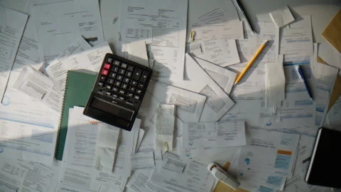 Tax forms calculator table composition top view. Messy office workplace closeup Stock Footage 332406909