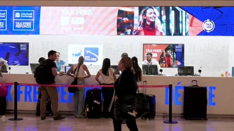 Tax-Free Refund Queue at Madrid-Barajas Airport (T4) – Last-Minute VAT Claims Stock Footage 305436104