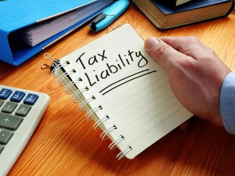 Tax liability reminder in the notepad. Stock Photos