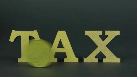 Tax payment concept. 50 cent coin rolling near word tax Video stock 290134003