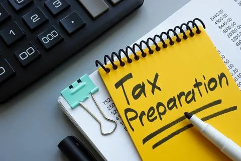 Tax preparation concept. Stack of papers and calculator. Stock Photos