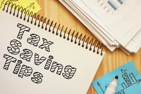 Tax-Saving Tips is shown on the conceptual business photo Stock Photos