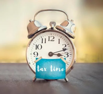 Tax time clock Stock Photos