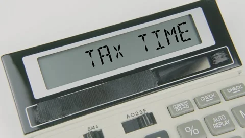 Tax Time Text or Words and Hand Typing Calculator Concept Stock Footage 307056882