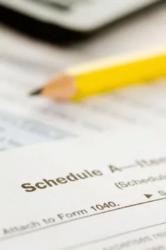 Taxes: focus on schedule a form Stock Photos