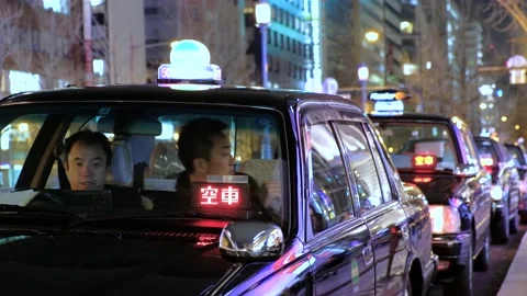 Taxi cab drivers queue pick up passengers in Japan Stock Footage 133212629