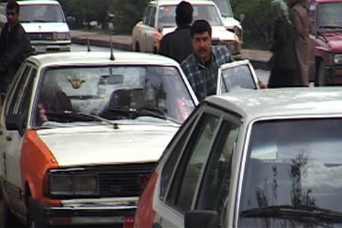 Taxi driver pushes his cab forward in long line for gasoline. Stock Footage 86753267