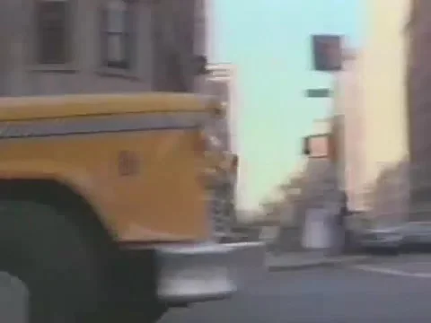 Taxi driving down Central Park West, New York City, 1980s Stock Footage