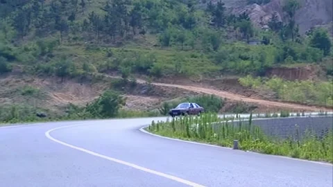 Taxi driving down the mountain Stock Footage 253772914