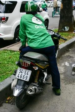 Taxi grabbike drivers in traffic Vietnam 30 october 2020 Stock Photos