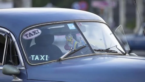 Taxi parked in street Stock Footage 77454341