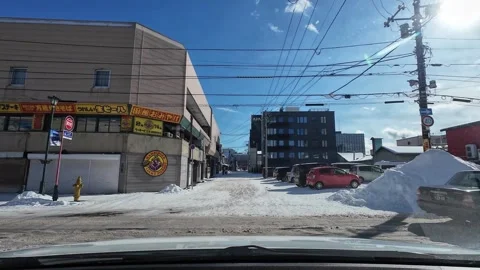 Taxi passes intersection in Hakodate fish market winter driving scene Video stock 333069371