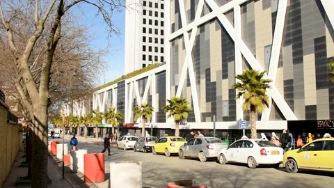 Taxi queue in front of Park Mall building in Setif city. Stock Footage 235613446