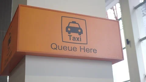 Taxi queue sign in busy transportation area Stock Footage 337603578