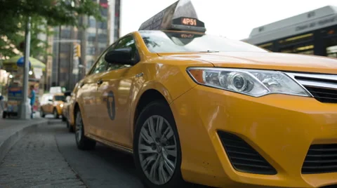 Taxicab door closes at taxi stand and cab driving away in Columbus Circle NYC Stock Footage