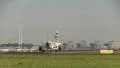 Taxiing airplane, tower in background HD Footage