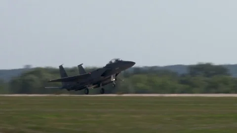 Taxiing of American F-15 Eagle fighter into two main chassis on runway. Stock Footage 107173853
