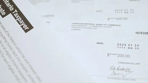 Taxpayer rebate cheques designed to help Ontario residents cope with financ.. Stock Footage 300737063