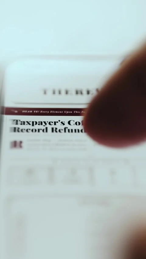 Taxpayer Record Refund News Article on Screen Stock Footage 337888261