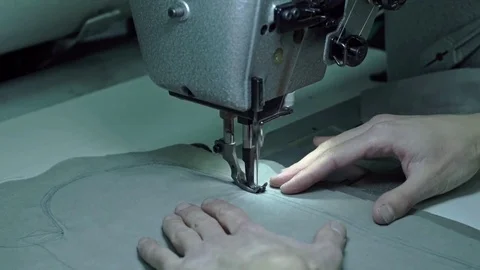 Taylor sews part of the sewing machine Stock Footage 70277715
