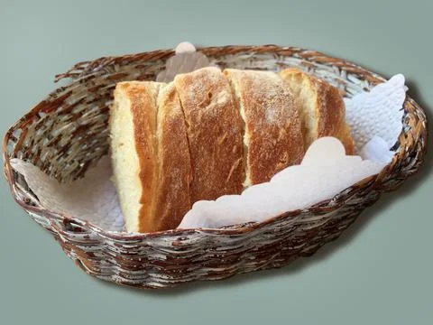 TBasket with fresh bread on table against color background Stock Photos