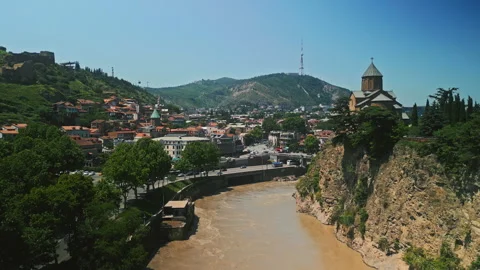 TBILISI, GEORGIA - Jun 17, 2024: Historic Metekhi Church overlooking Tbilisi Stock Footage 311069809
