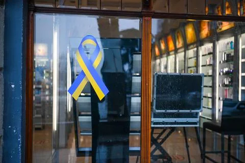 TBILISI, GEORGIA - MARCH 11, 2021. Ukrainian flag sign on shop window in support Stock Photos