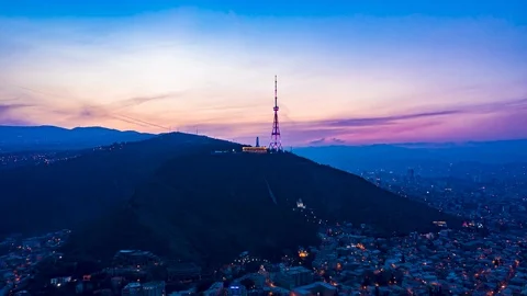 TBILISI HYPERLAPSE, Sunset over Mtatsminda mountain, shot with DJI Mavic 2 Pro d Video stock 125704526