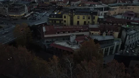 Tbilisi old town sunset forward up panning reveal, 4K Drone Stock Footage 200423222