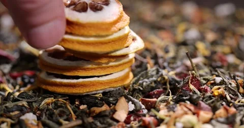 Tea with added flavors and pieces of fruit and cut dried yellow lemons, bright Stock Footage 324877435