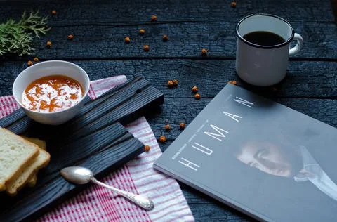 Tea and bread with jam on a black background Stock Photos