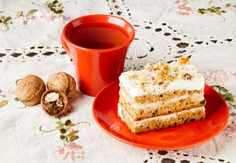 Tea and cake with walnuts Stock Photos