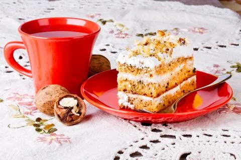 Tea and cake with walnuts Stock Photos