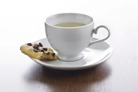 Tea and cookie bite Stock Photos