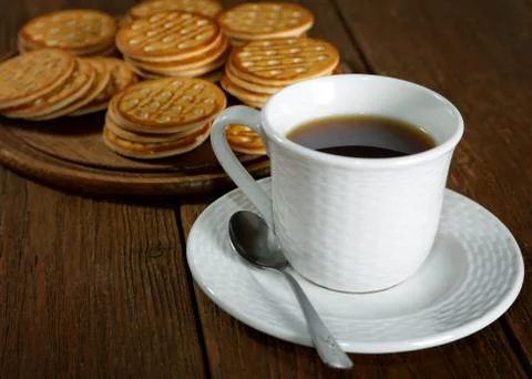 Tea and cookies on a rustic table Stock Photos