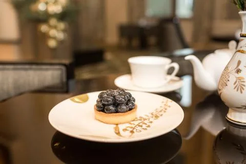 Tea and dessert on table Stock Photos
