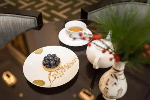 Tea and dessert on table Stock Photos