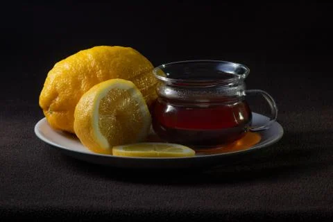 Tea and lemons on the plate on the table 写真素材