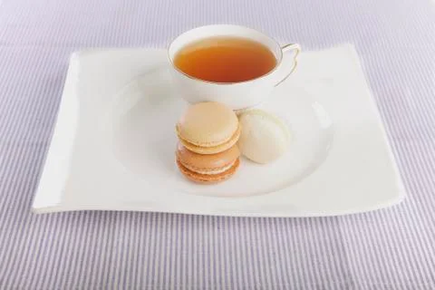 Tea and macaroons Stock Photos