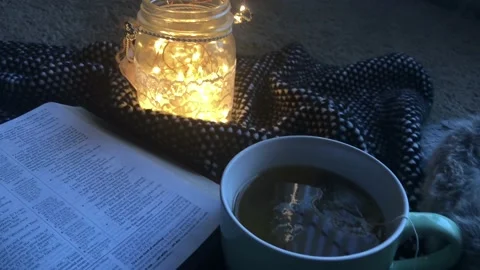 Tea and Open Bible Zoom Out Vídeo Stock 100696735