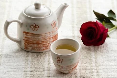 Tea and rose Stock Photos