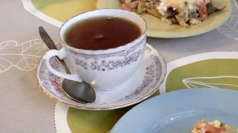 Tea and slices of pizza Stock Footage 43056836