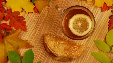 Tea and snack rotating on the table Stock Footage 255206044