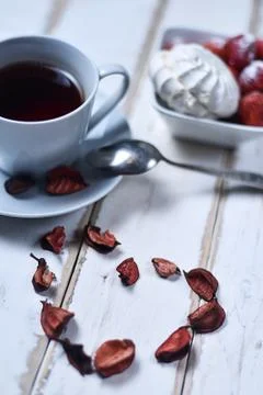 Tea and strawberries with marshmallows Stock Photos