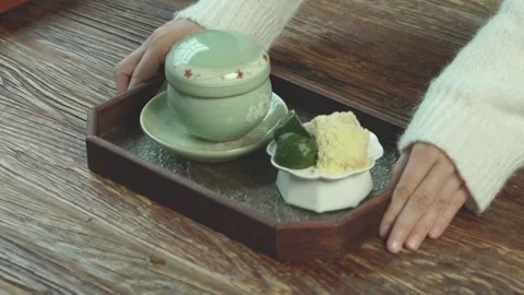 Tea and Traditional Snacks Served on Tray on Table 動画素材 335797592
